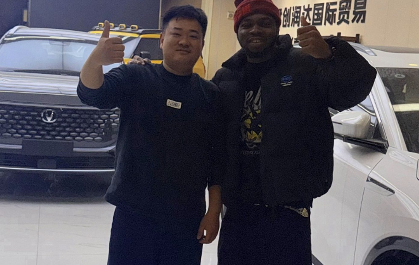 Yodo's founder with our rep at a car dealership in China