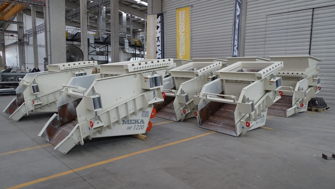 Rows of new industrial machines on the factory floor, ready to ship
